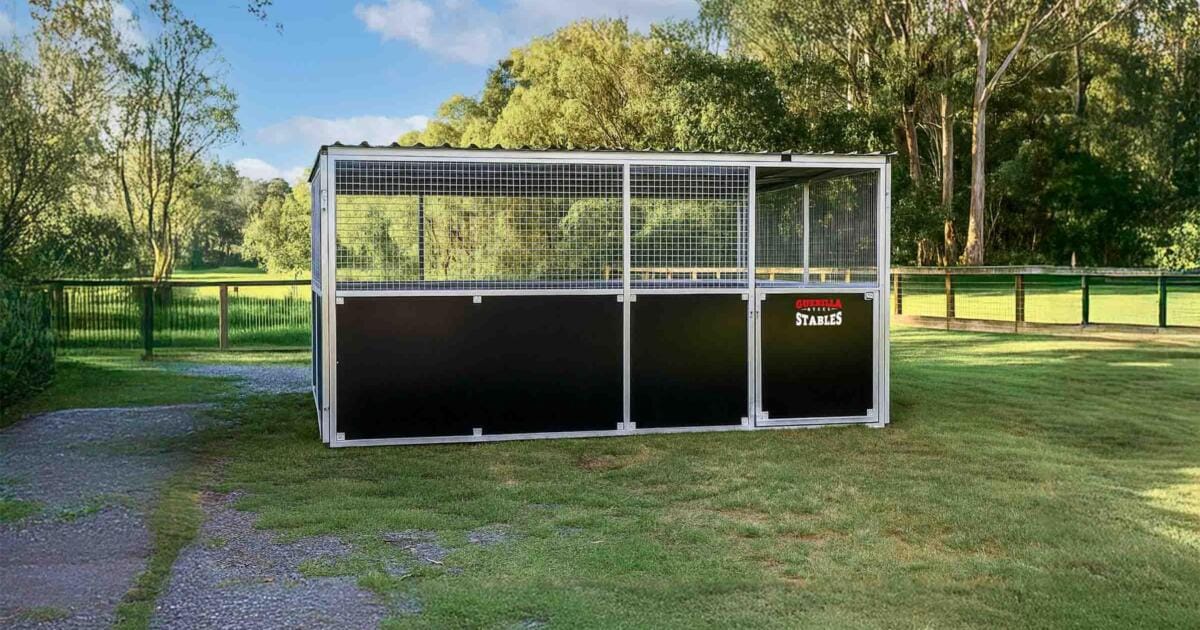 Front view of Animal shelter anchored on grass field.
