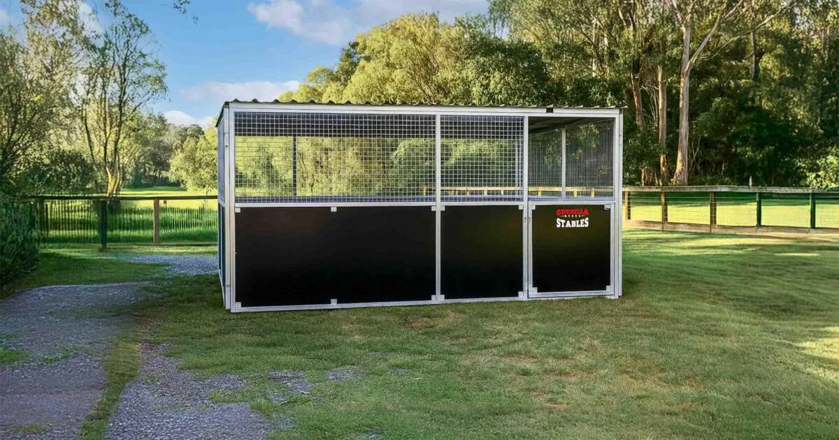 Front view of Animal shelter anchored on grass field.