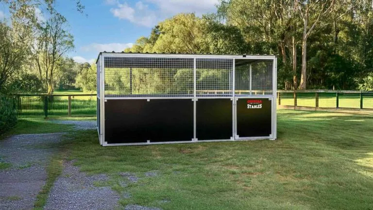 Front view of Animal shelter anchored on grass field.