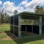 Outdoor animal shelter under clear blue sky