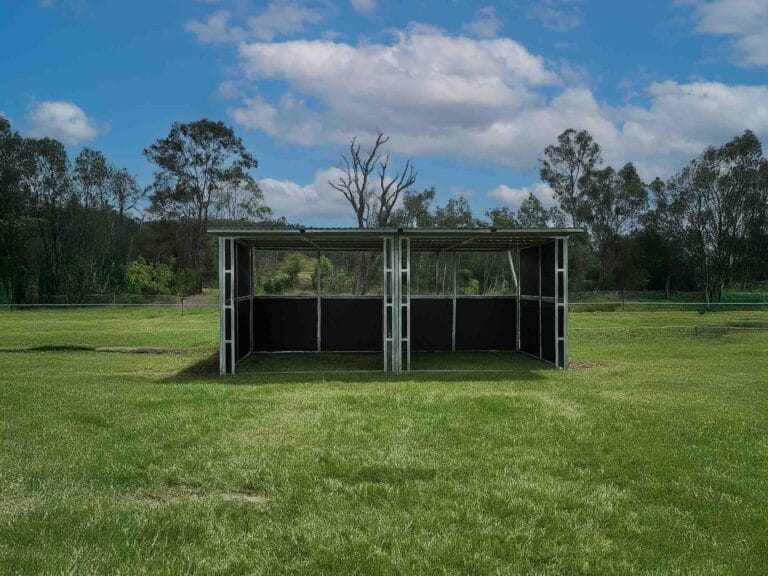 Outdoor steel shelter on grassy field