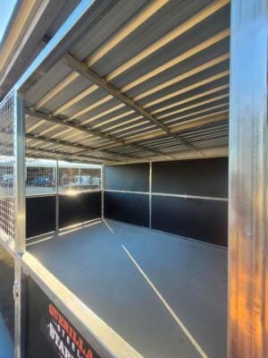 Empty steel cage with metal roof panels