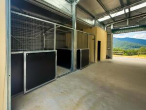 Spacious open stable with mountain view.