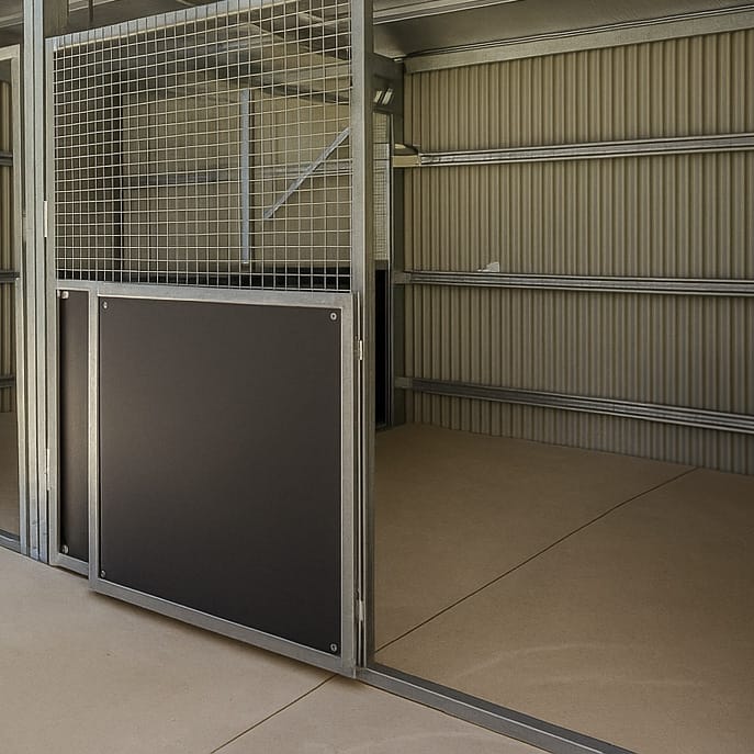 Open pen with beige flooring and metal bars