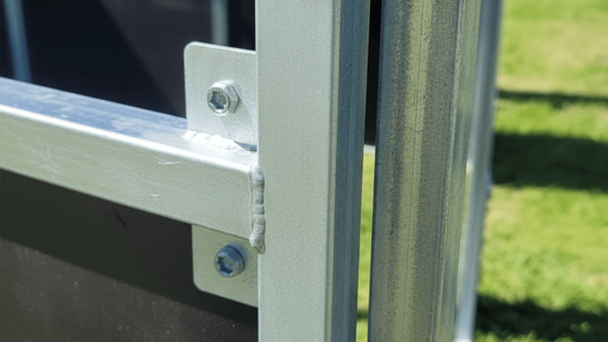 Close-up of a steel stable frame during stable build process outdoors.