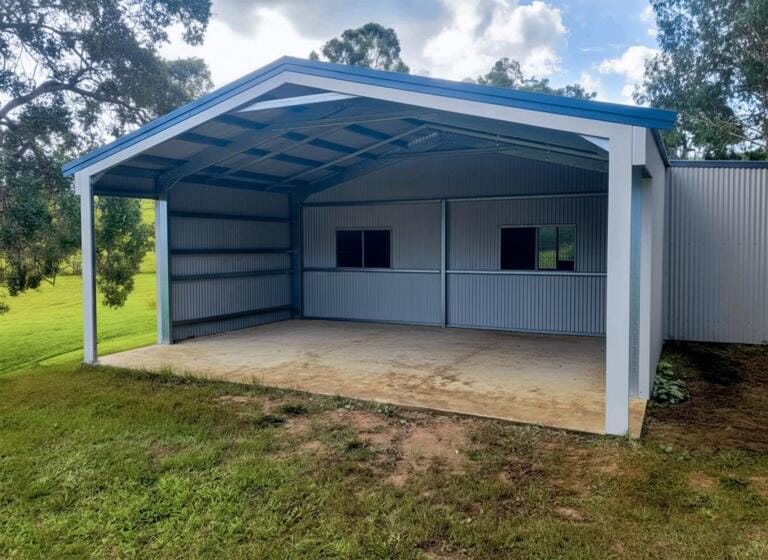 Metal carport on grassy yard