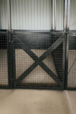 Powder coated steel horse stable with mesh gates
