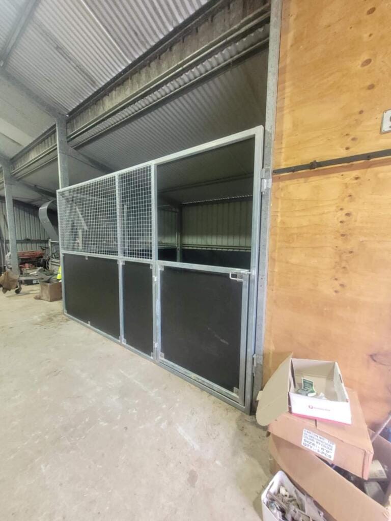 Industrial shed interior with box and metal cage
