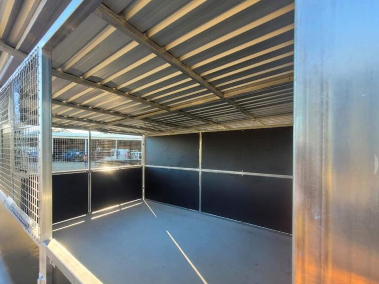 Empty metal cage with open roof.