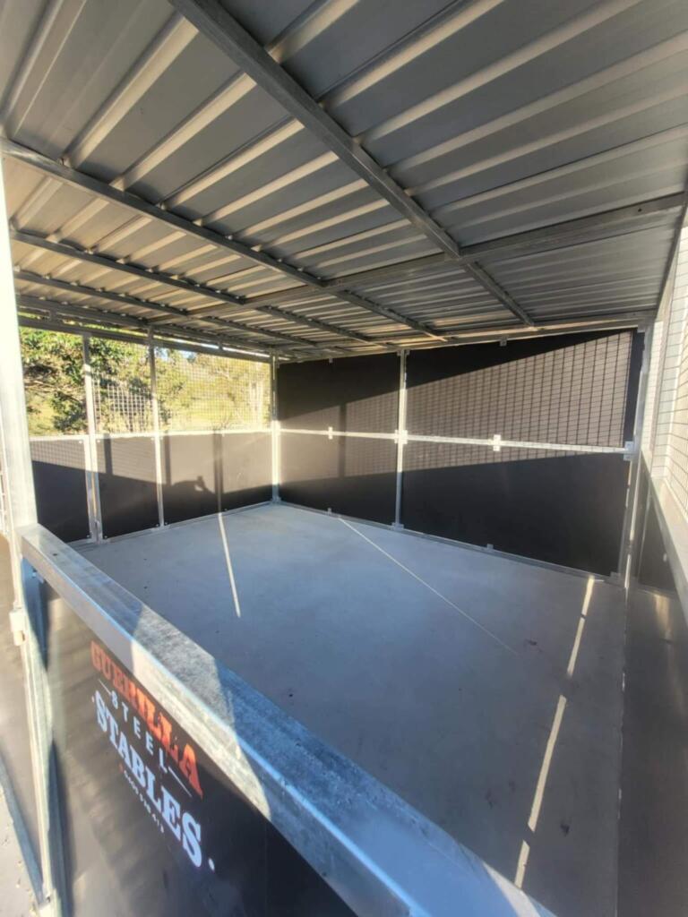 Guerilla Steel Stables with metal roof and walls.