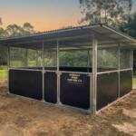 Guerilla Steel horse stable in Samford Valley with extended roof span, rear gutter rail, mesh ventilation panels and form ply kickboards.