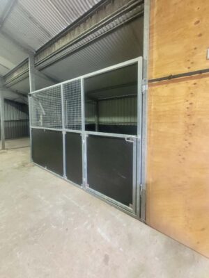 steel mesh horse stable gate installed in shed conversion stall retrofit