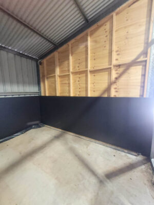 horse stable interior with kick safe form ply panels and steel frame retrofit inside shed