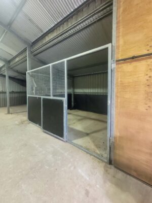 retrofit horse stable panel system installed inside existing shed bay