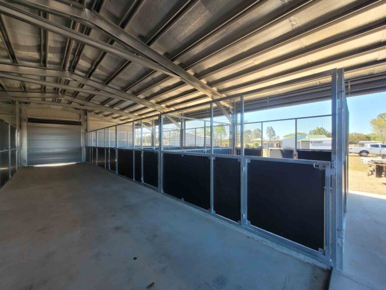 Four extra-large stables line the breezeway, creating a calm, open environment where horses can see each other while remaining safely separated.