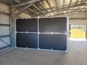 fully enclosed horse stable bay with solid ply panels inside steel shed