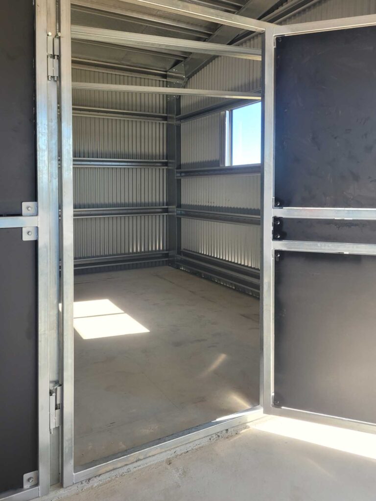 enclosed horse stable bay with solid ply panels inside rural shed storage stable