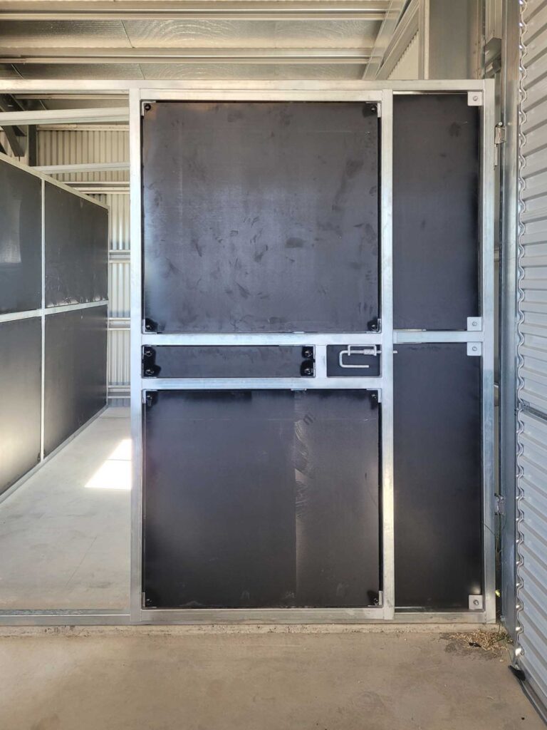 heavy duty steel horse stable gate with solid kick panels inside shed