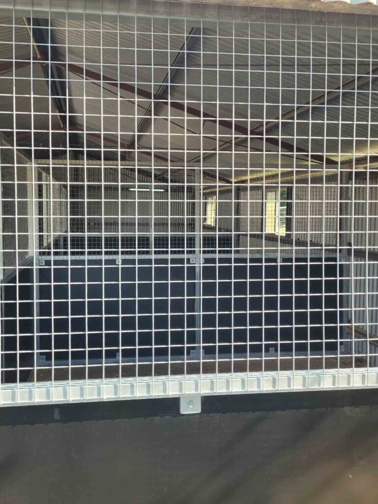 three bay indoor horse stable retrofit using ply and mesh panels installed inside farm shed