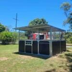 Steel horse stable bay with front gate tie-up rail and integrated feed hatch