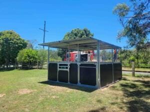 Steel horse stable bay with front gate tie-up rail and integrated feed hatch