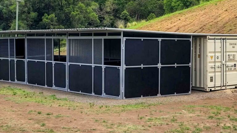 completed 3 bay modular horse stable integrated with shipping container and roof extension